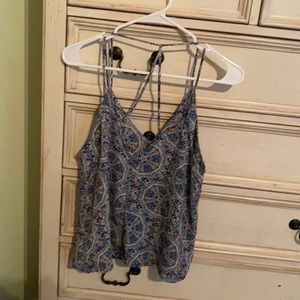 Spaghetti strap top with crisscross in back with a flower kaleidoscope design